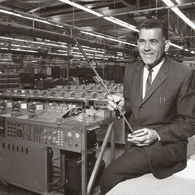 Karsten Solheim holding a PING putter