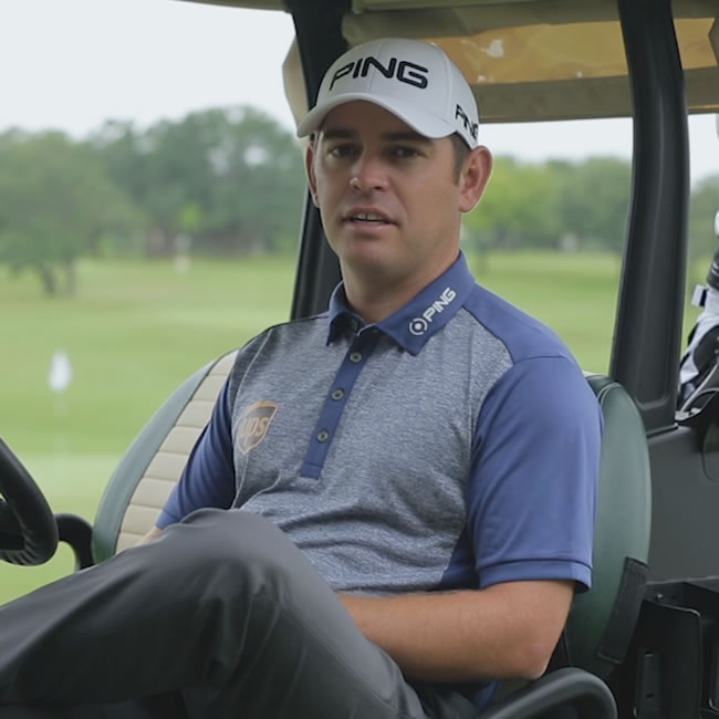 Louis Oosthuizen sitting in golf cart