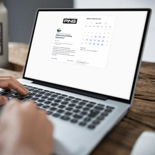 golfer using appointment scheduling website on laptop computer