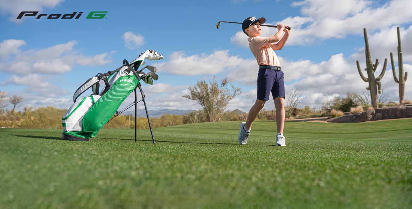 Junior golfer hitting shot with Prodi G iron